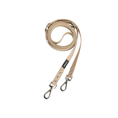 Woofyn beige monitoimihihna. 